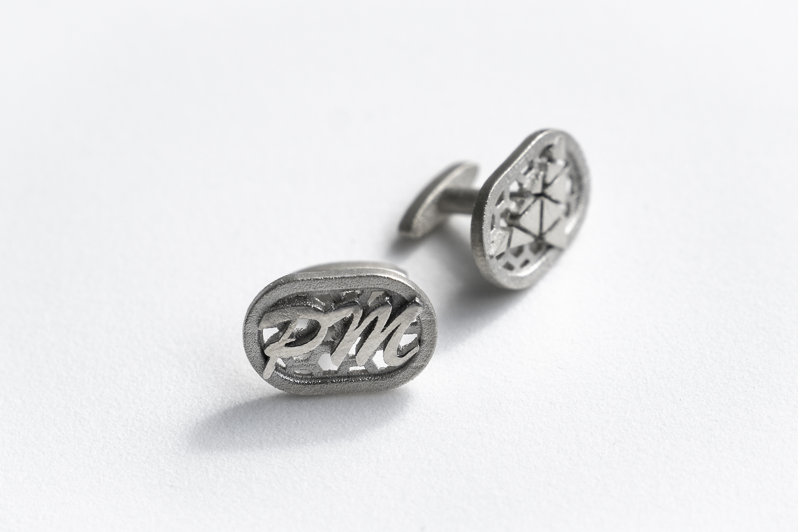 two stainless steel cufflinks